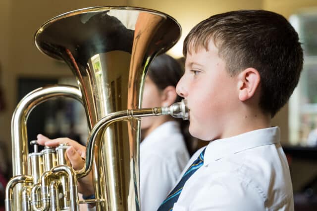 Prep boy playing the tuba