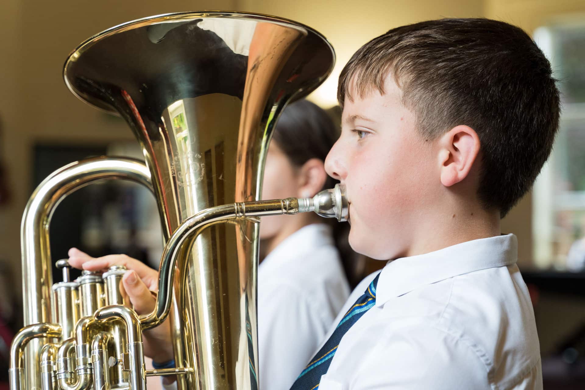 Prep boy playing the tuba