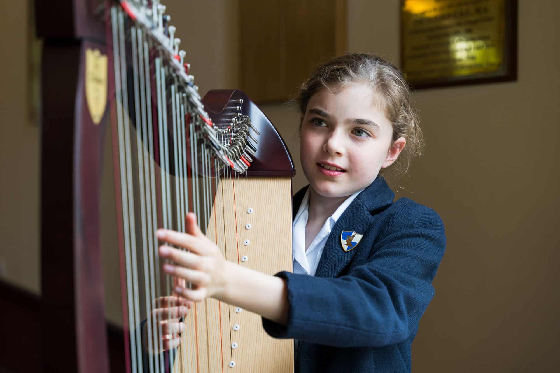 Ardingly Prep girl playing the harp
