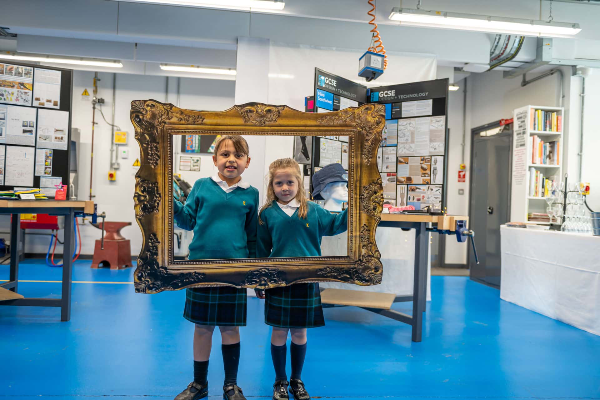 Prep children holding up a frame at a senior DT exhibition