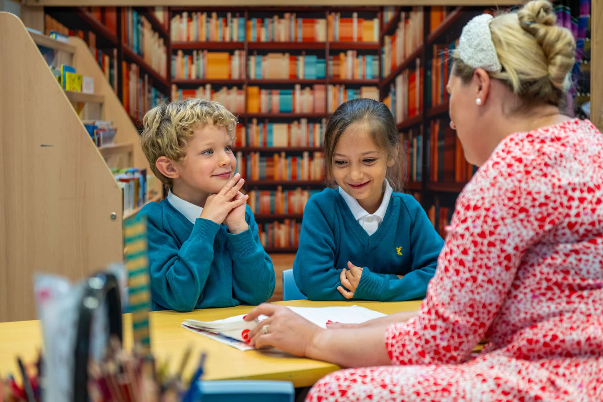 Children listening to their teacher in a lesson