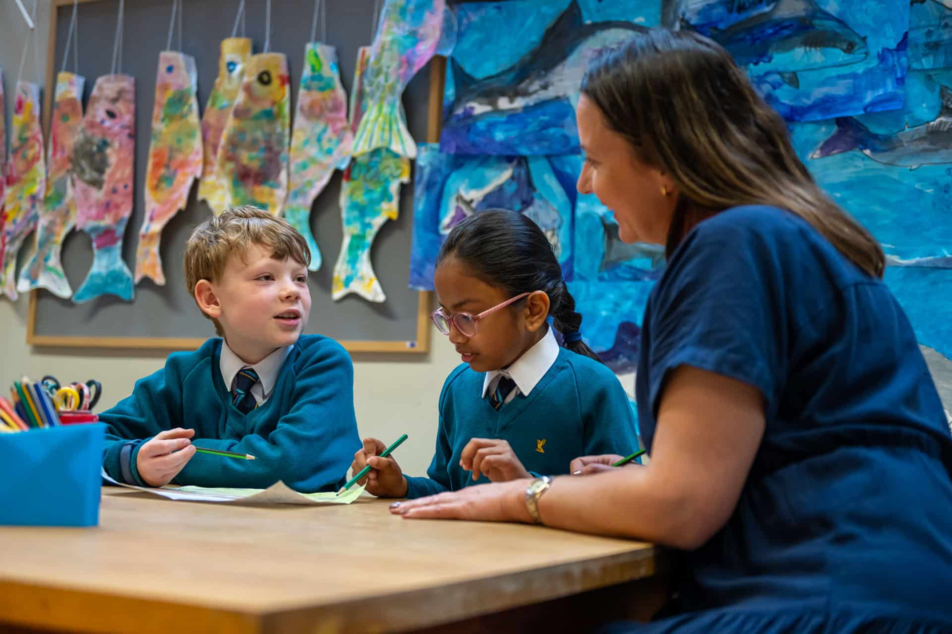 Prep children talking to their teacher in a lesson