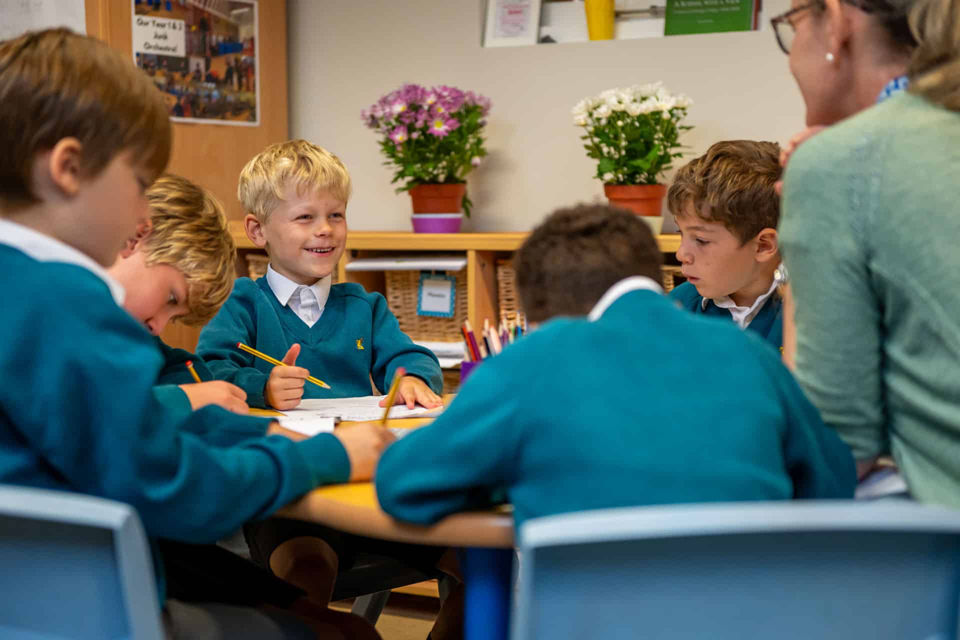 Prep children smiling at their teacher in a lesson