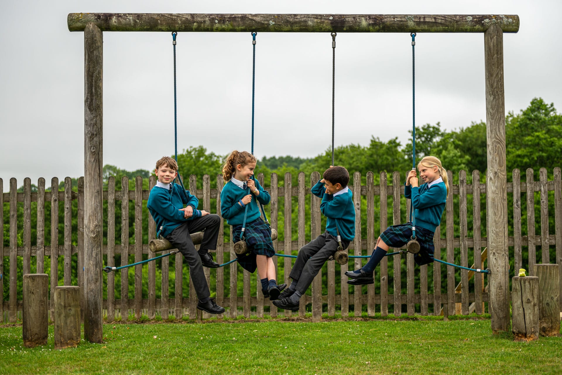 Prep children on a swing
