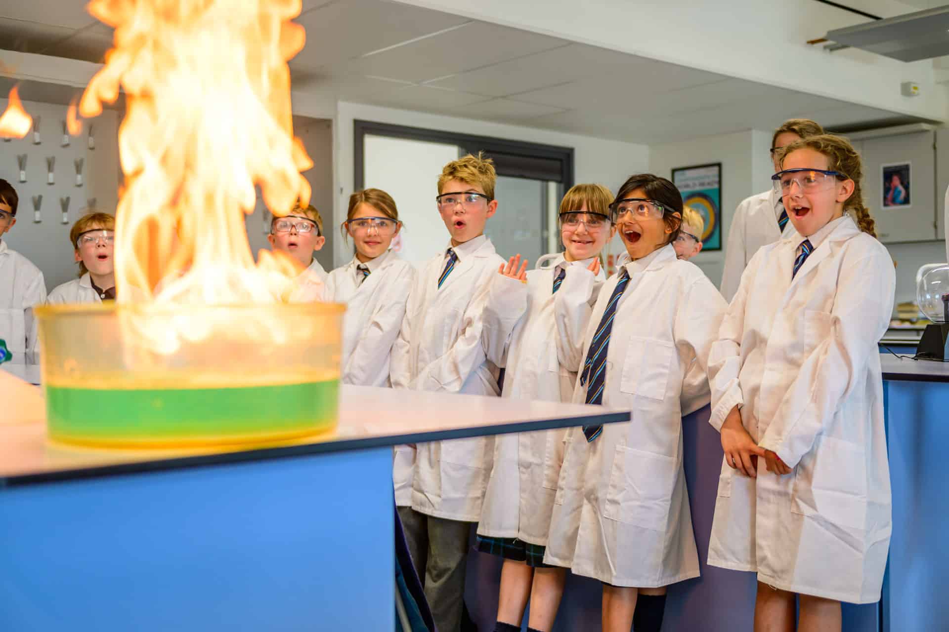 Prep children looking at flames in a science lab
