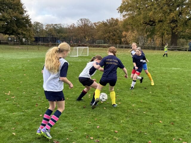 Girls' participating in a football masterclass