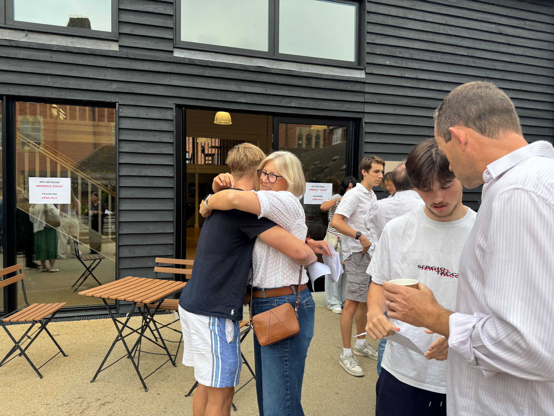 A congratulatory hug from mum as A Level results come out.