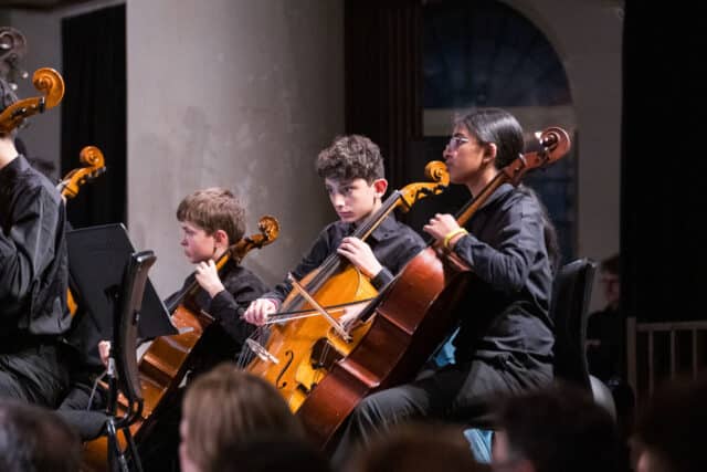 Cello students performing at Syphonia Square, London.