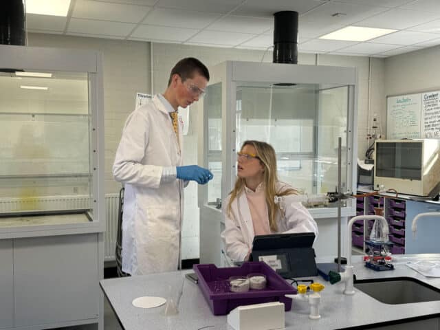 Sixth Form Students working out an experiment on Chemistry Day.