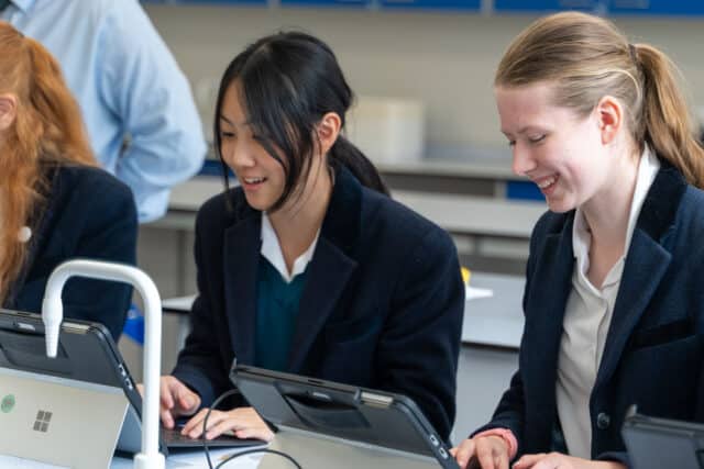 Classroom with girls on a computer