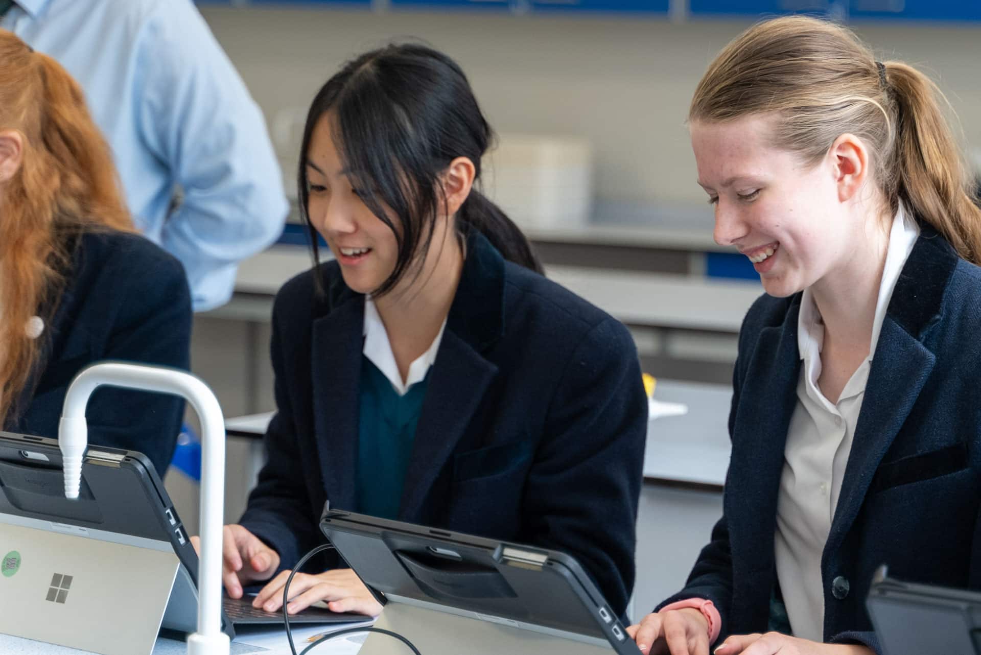 Classroom with girls on a computer