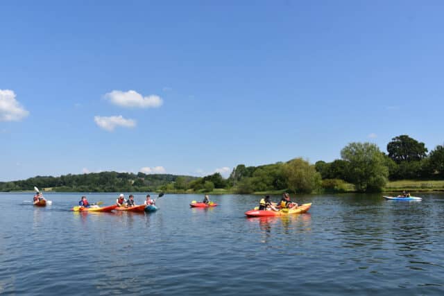 Stunning view of Ardingly Reservoir with kayaks on the water.