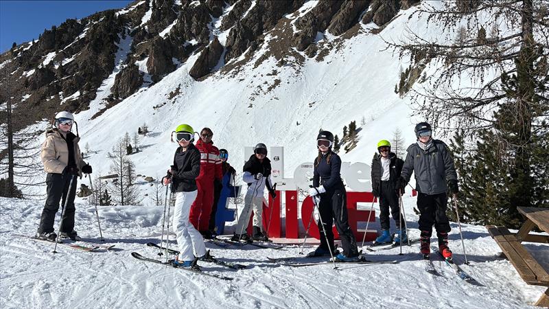 School ski trip students on slope