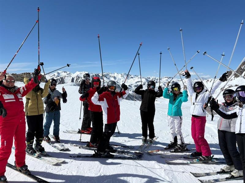 Ski trip students on slopes