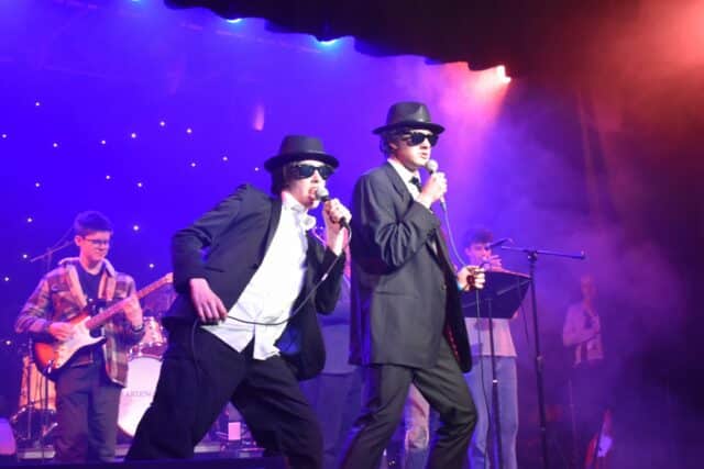 Two students performing Blues Brothers at the ABC concert