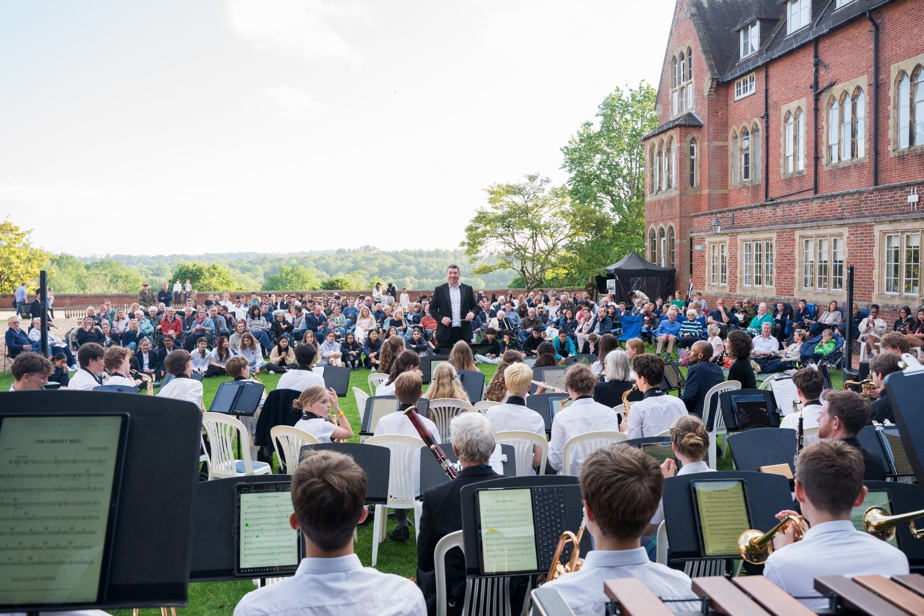 Student musicians facing the conductor at the summer concert