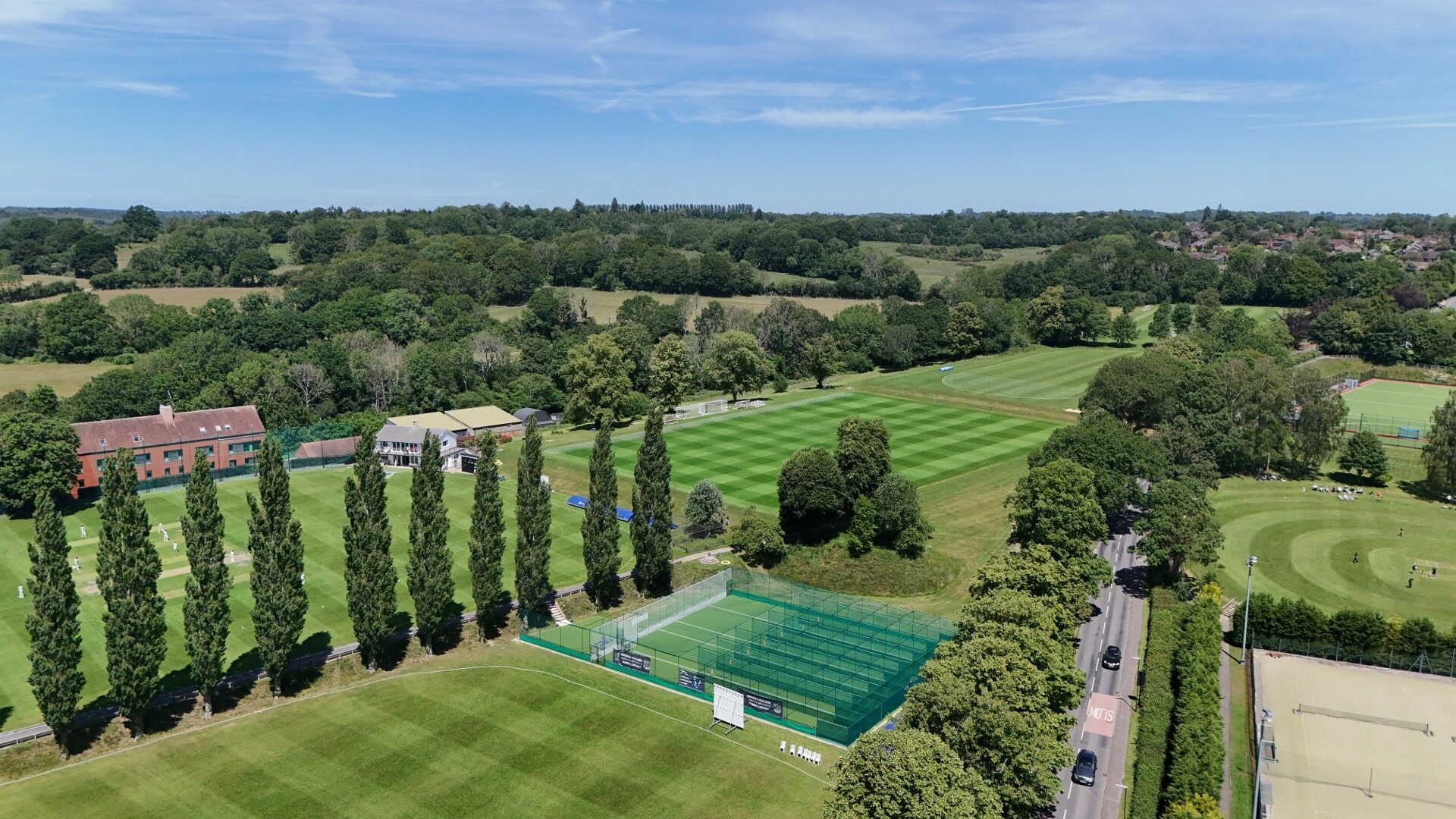 Ardingly Campus from the air showing the first team cricket and football pitches, cricket nets and astros.